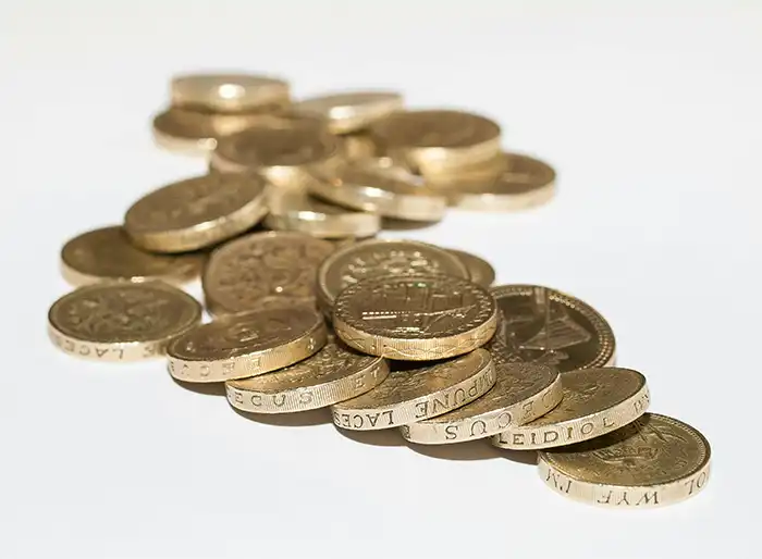 Capital Gains Tax (CGT) on UK Property for Non-Residents Pile of pound coins